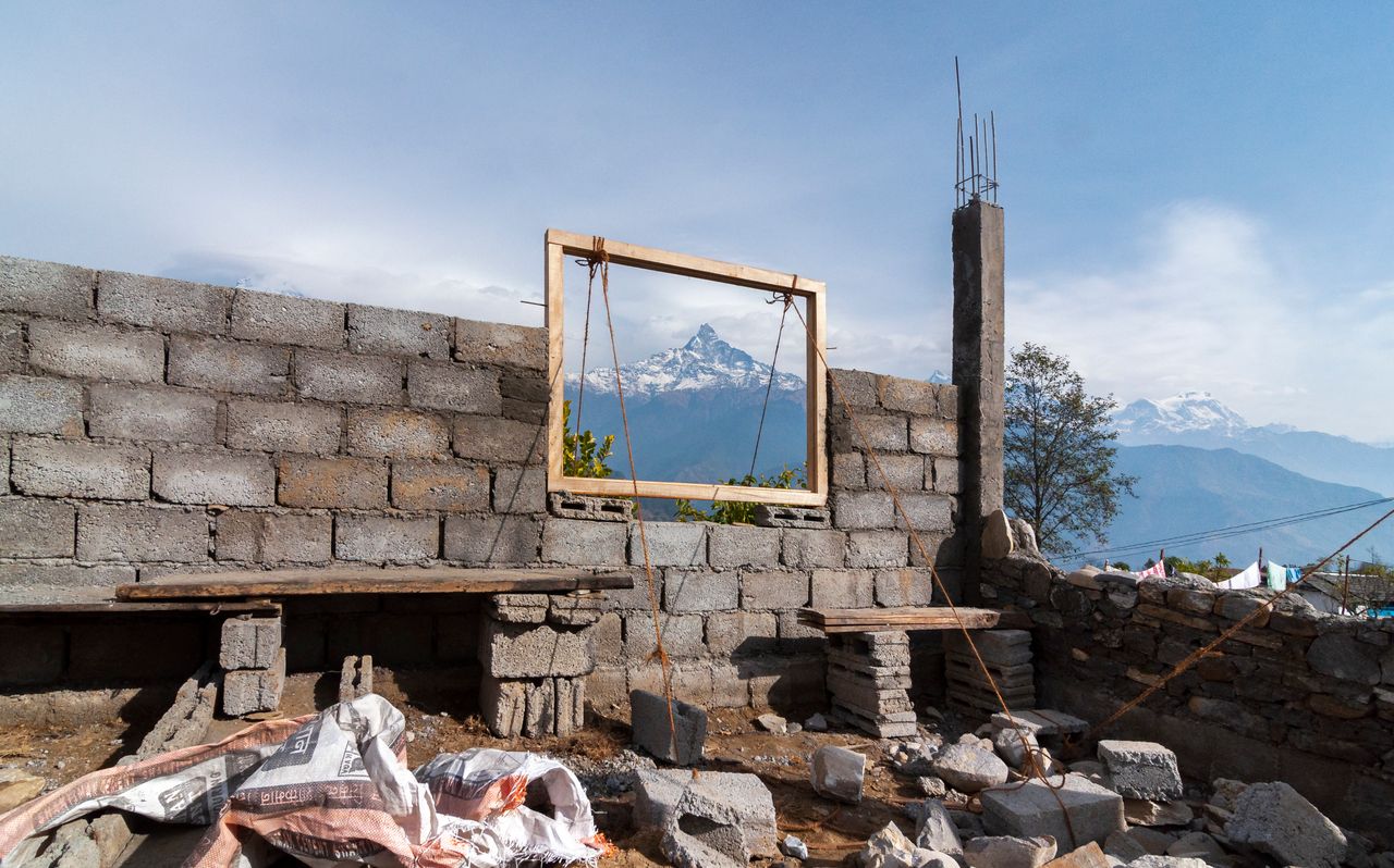 Reconstruction work in Nepal with Machhapuchhre in the background