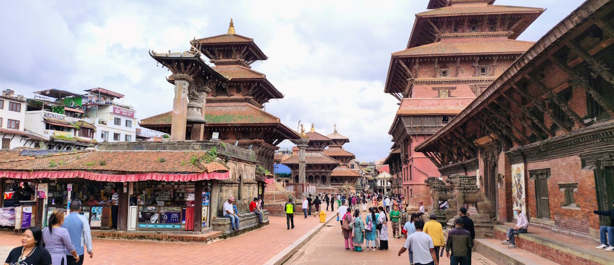 Visitors exploring Patan Durbar Square during a small-group walking tour in Kathmandu, Nepal